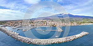 Riposto- vista aerea dall\'alto sul porto della cittÃ  durante giornata di sole con Etna sullo sfondo photo